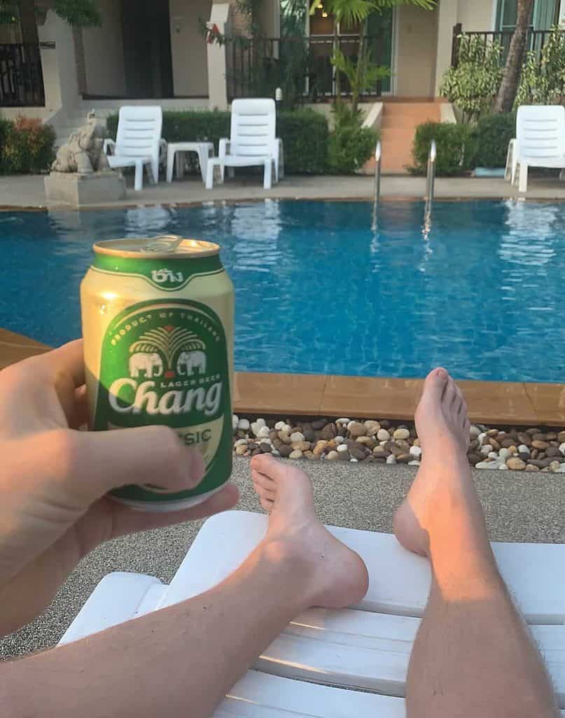 Chilling by the pool with a Chang beer